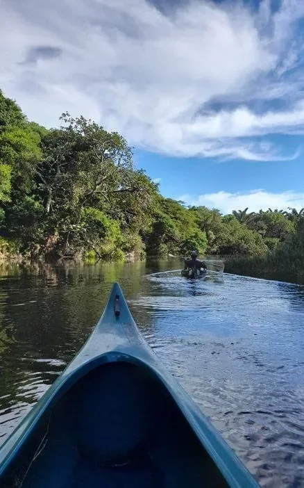 Guided canoeing through the waterways of the Kosi lake system